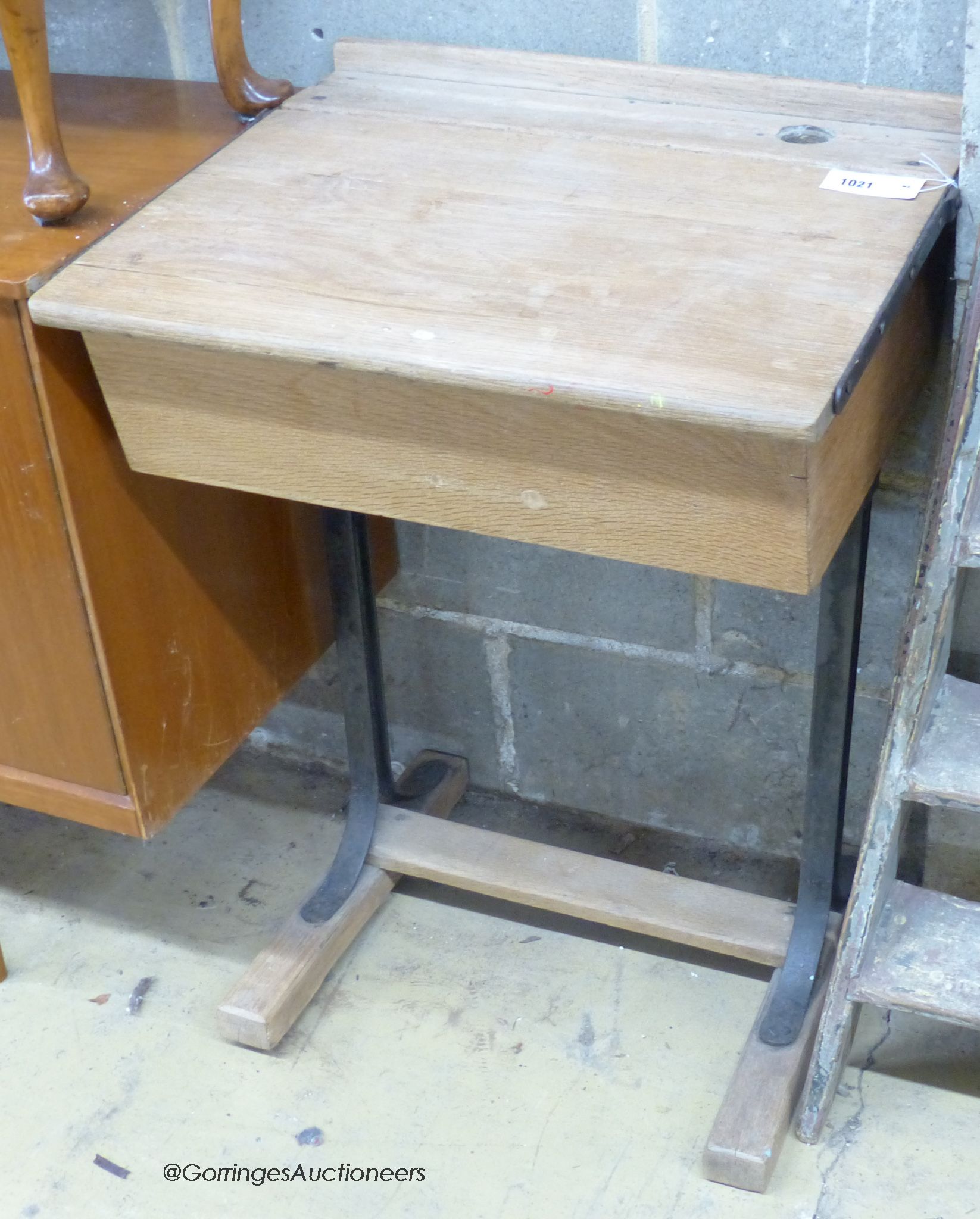 A vintage oak student's desk, width 56cm, depth 47cm, height 77cm